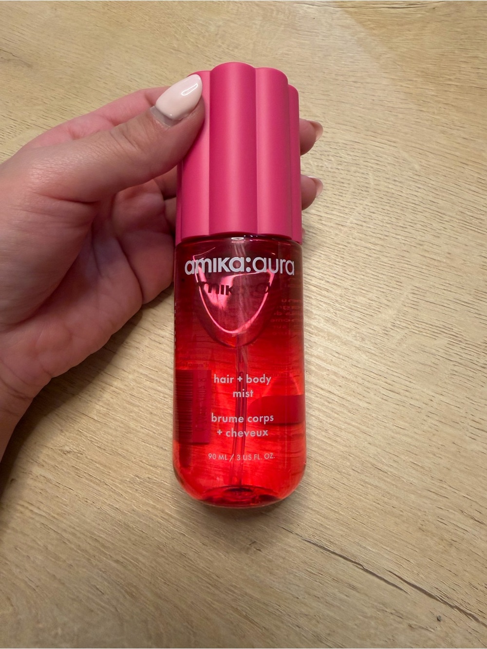 amika aura Hair + Body Mist in Bright Pink Bottle